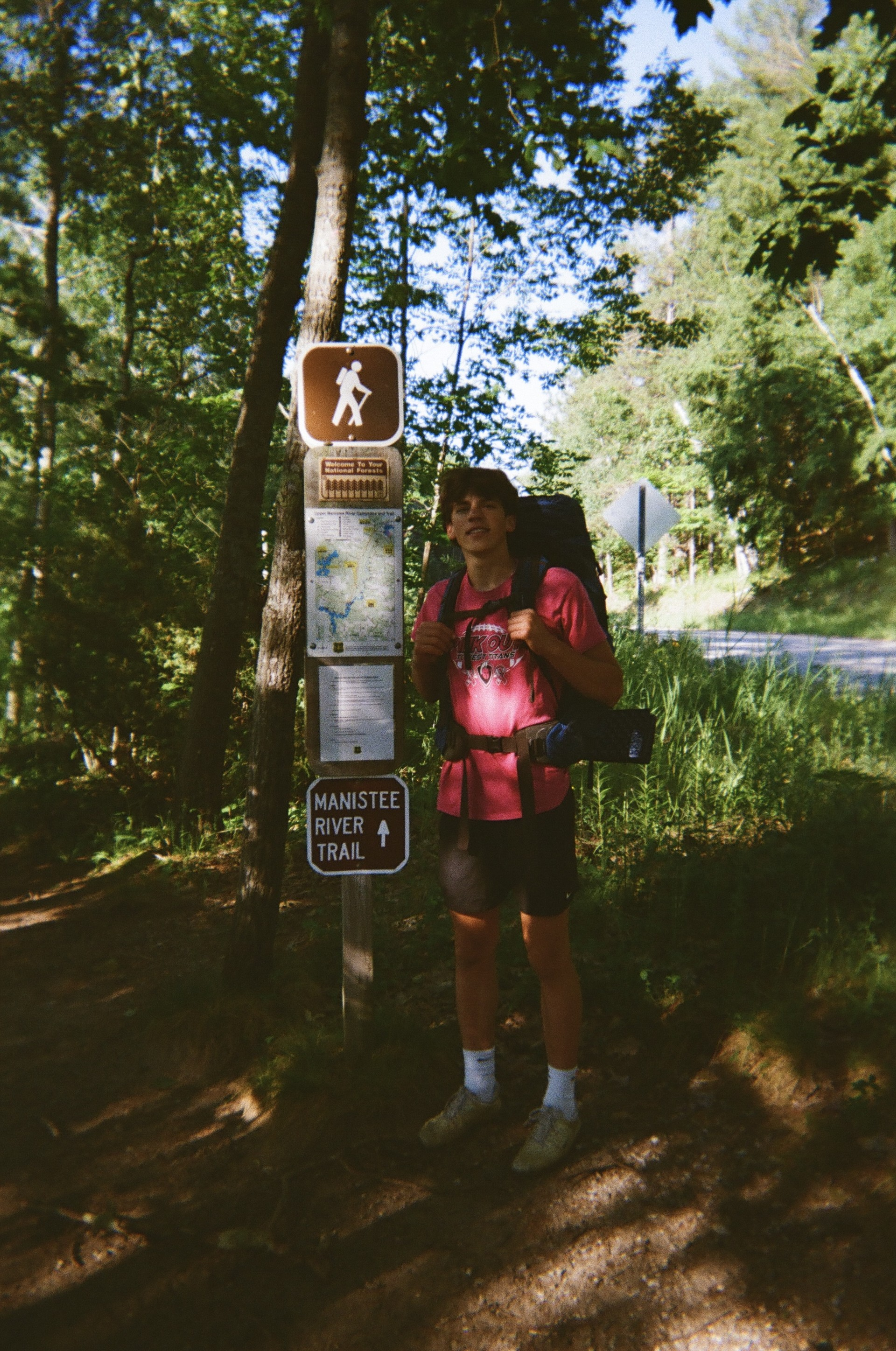 Will carrying a backpack beside the Manistee River Trail sign